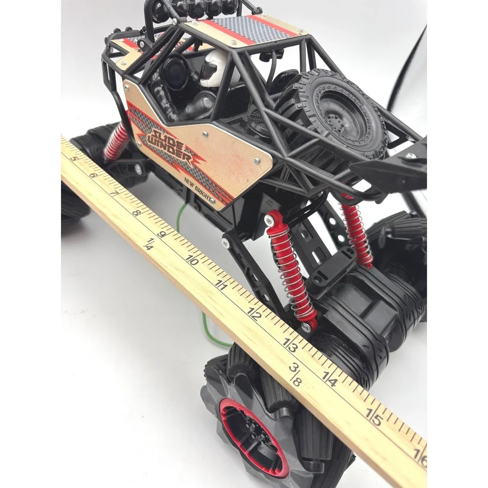New Bright Slide Winder 4x4 RC Monster Truck Black Red Gold Roll Cage Toy